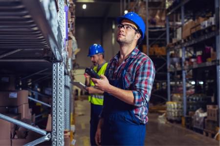 Male warehouse worker with RFID bar code scanner